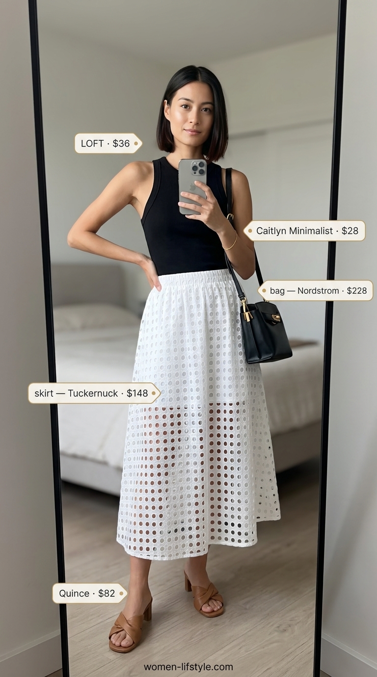 Trendy preppy summer outfits for women 2026: White eyelet skirt, black tank top, and leather mules for a gallery opening.