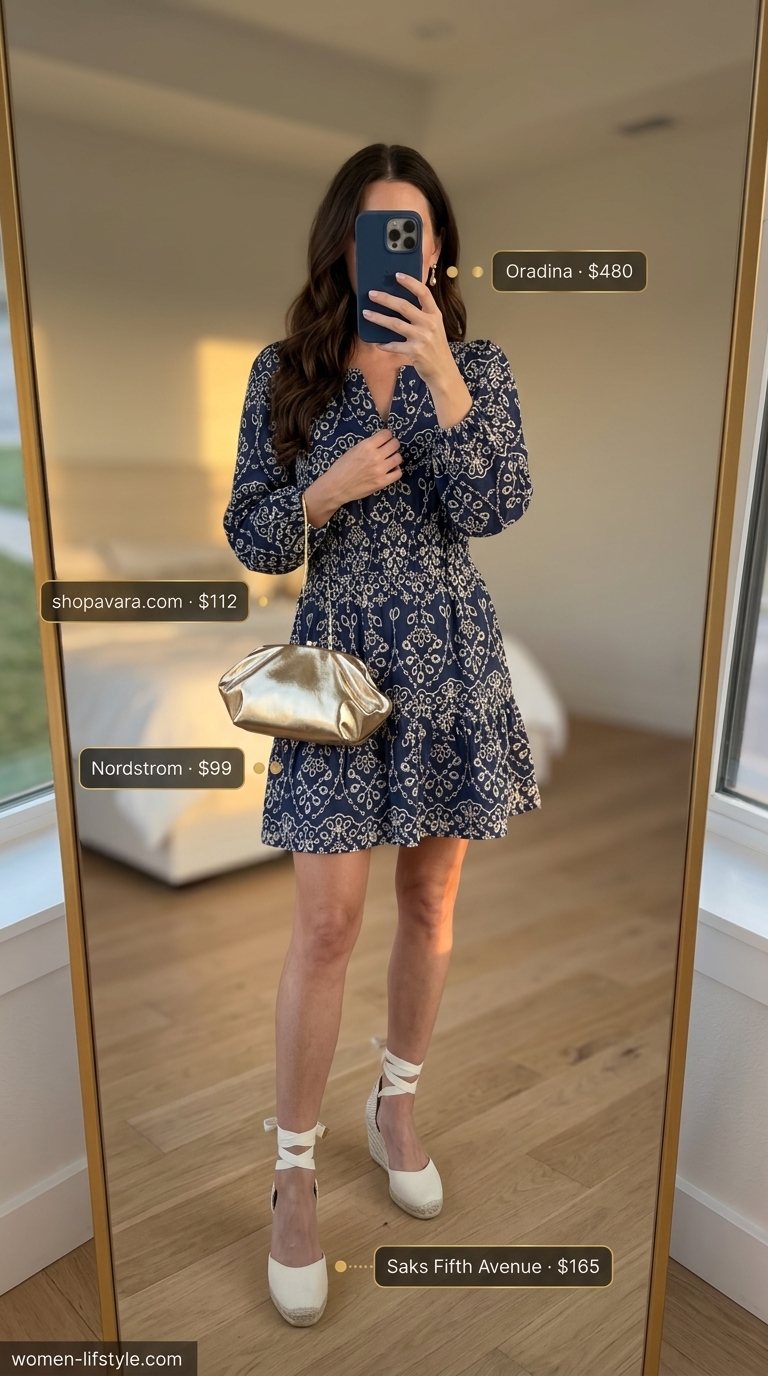 An elegant navy linen blend mini summer sundress 2026 with ivory embroidery, styled with gold accessories and heeled espadrille wedges for a sophisticated coastal evening.